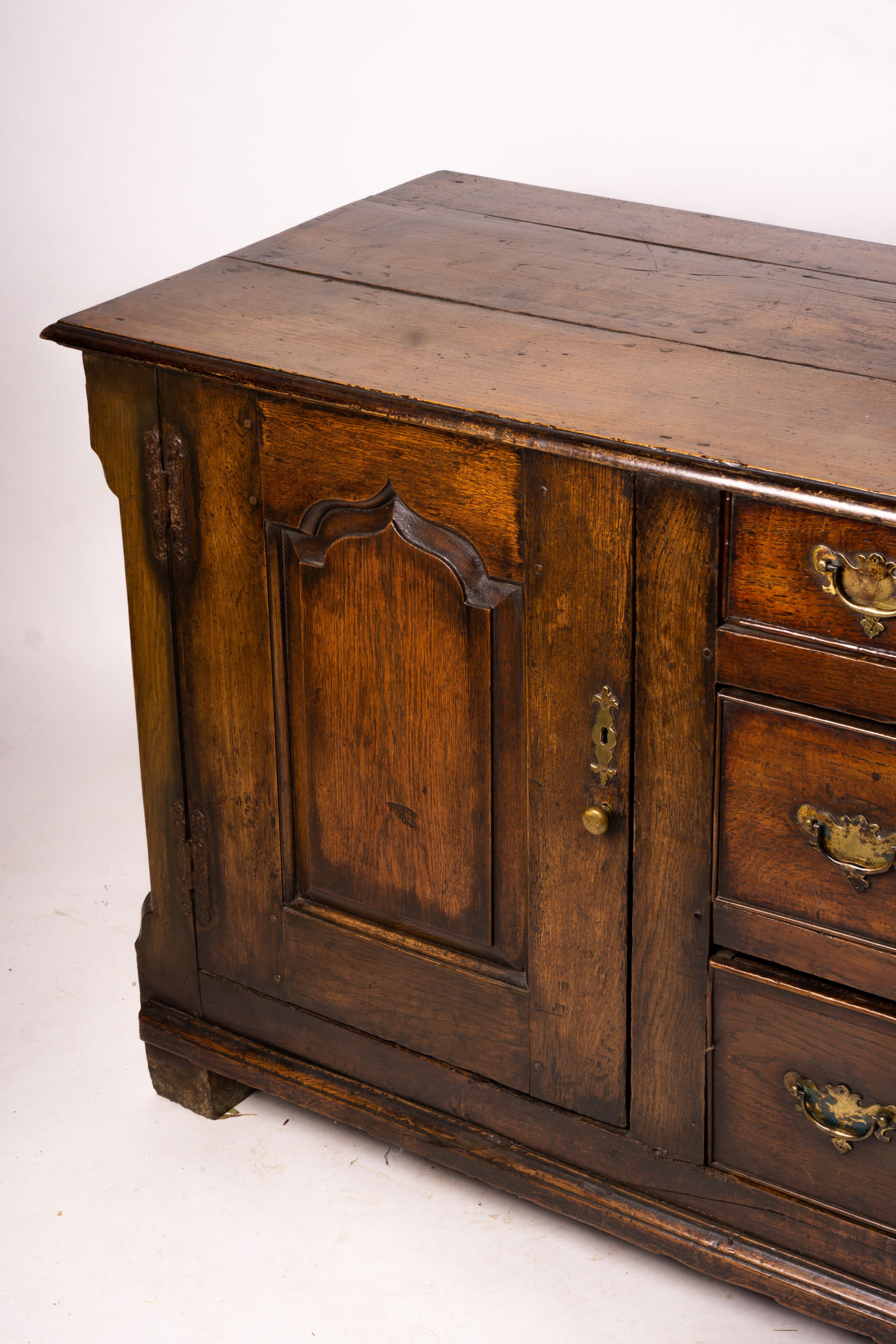 An 18th century oak low dresser base, length 191cm, depth 56cm, height 78cm